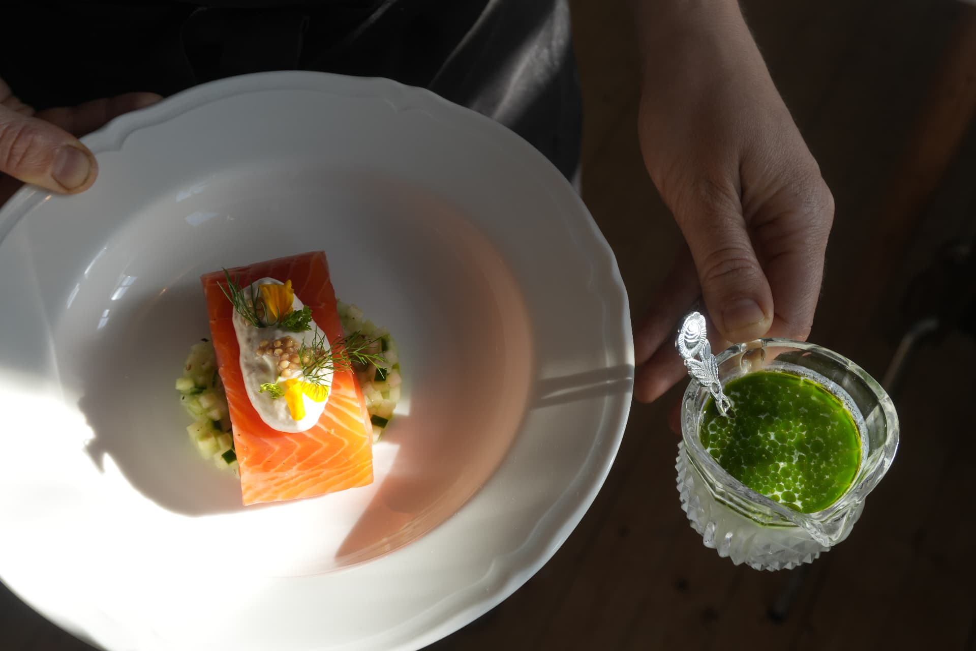 Cured salmon with dill, served with herb oil